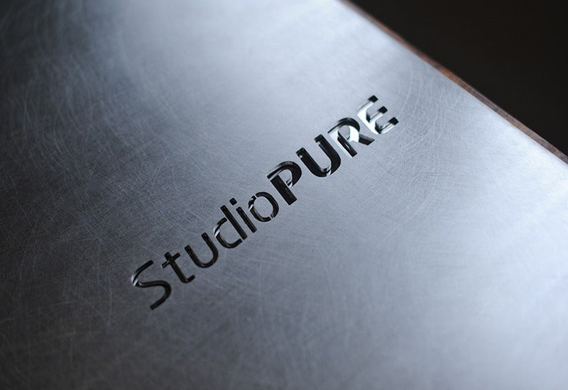 Modern office signage made from vibration finished stainless steel with black paint-filled etching for a sleek professional look